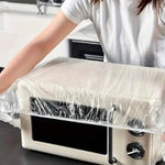 Elasticated plastic couch protector securely fitted over a sofa.