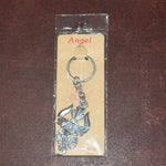 Metal keychain displaying detailed craftsmanship of Trishul and Damru symbols