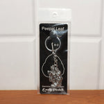 Back view of Radha Krishna metal keychain showing craftsmanship