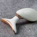 Top view of the Neck Face Massager's massage head and silver sensing rings.