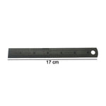 Close-up showing detailed markings on steel measuring ruler