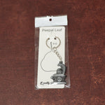 Display of durable metal Shivling keychain with snake design