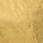 Close-up of a self-adhesive golden kitchen foil sticker roll.