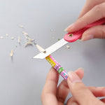 Vibrant multicolour handle of a mini paper cutter knife showing ergonomic design.