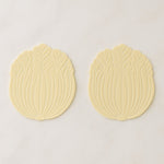 Silicone leaf coaster protecting surface from heat and moisture with hot beverage