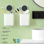 Adhesive bathroom organizer cups installed on wall