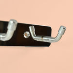 Wall mounted stainless steel coat hook rack showing smooth rounded edges