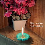 Assortment of reusable silicone diyas in various colours and patterns, ideal for home decoration.