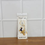 Krishna keychain with multiple charms and sturdy metal key ring