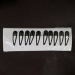 Matte finish metal hair clips held for size reference