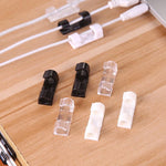 Plastic cable clips managing wires on a car dashboard, keeping vehicle interiors clutter-free.