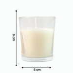 Close-up of a lit Blueberry Scented Votive Candle, showing the gentle flame.