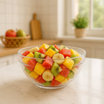 Transparent bowl used for serving snacks and fruits with textured grip