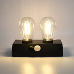 Indo Glow Solar Double LED Lamp providing ample light for an outdoor area.