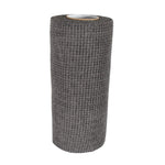 Hand demonstrating the flexible and easy-to-handle kitchen scrub cloth.