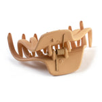Side profile of matte plastic hair clamp showing lightweight structure