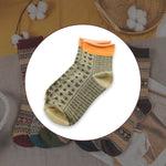 Pair of grey women's ankle socks, showcasing soft texture and comfortable fit.