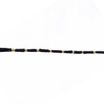 Red Mauli rakhi with gold and pearl details for festival