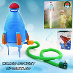 Children laughing while being sprayed by the rocket water sprinkler.