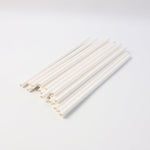 Eco-friendly paper straws displayed with green leaf, highlighting sustainable use