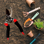 Close-up of sharp red garden shears blade and ergonomic handle.