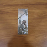 Close-up detail of metal hammer shape on keychain