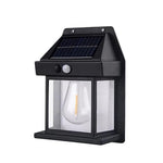 Hand holding a Solar Wall Lamp to show its compact size and design.