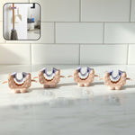 Close-up view of wall mounted broom and mop holder clip
