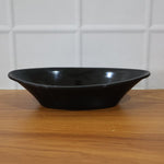 Deep black plastic serving bowl perfect for salads and snacks