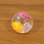 Light-up transparent sensory bouncy ball being used for fun