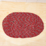 Detail shot of textured red floor mat for indoor use