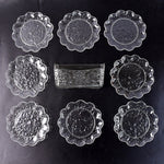 9-piece plastic bowl set with serving tray displaying transparent bowls and plates