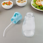 The 170ml oil dispenser bottle complete with its protective cap and fine mist nozzle.