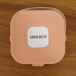 Back view of travel-friendly mini jewelry storage box with built-in mirror