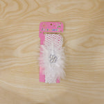 Elegant baby hair accessory featuring floral bow and elastic fabric