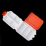 Open orange pill organizer showing dual hinged snap-lock lids
