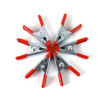 Detail of the 2-inch metal spring clamp's rotating jaw pads providing a tight, secure grip.