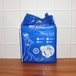 A pack of  Sanitary Pads 330mm next to a single pad, showcasing both the product and its packaging.