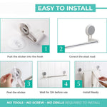 Self-adhesive towel rod positioned near shower for hand towel drying