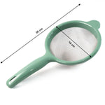Kitchen strainer with wide rim and resting ear for stable placement on pots