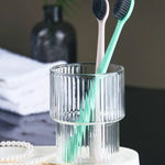 Toothbrush organizer tray with divided slots for brushes and grooming tools