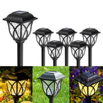 Waterproof FitFuzion solar lights demonstrating easy stake installation into soft garden soil.