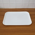 Angled photo of simple functional white plastic serving tray