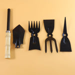 Complete gardening hand tool kit in use for planting and weeding