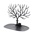 Jewellery display stand with deer antler design holding earrings