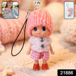 Mini doll keychain hanging on a keyring