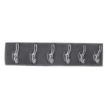 Stylish hooks rail placed in a bedroom, neatly organizing clothes and accessories.