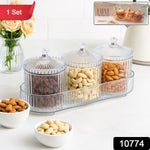 Close-up of dry fruit storage jar with clear ribbed glass and lift-top lid