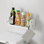 No-punch elephant wall shelf providing storage in a modern bathroom.