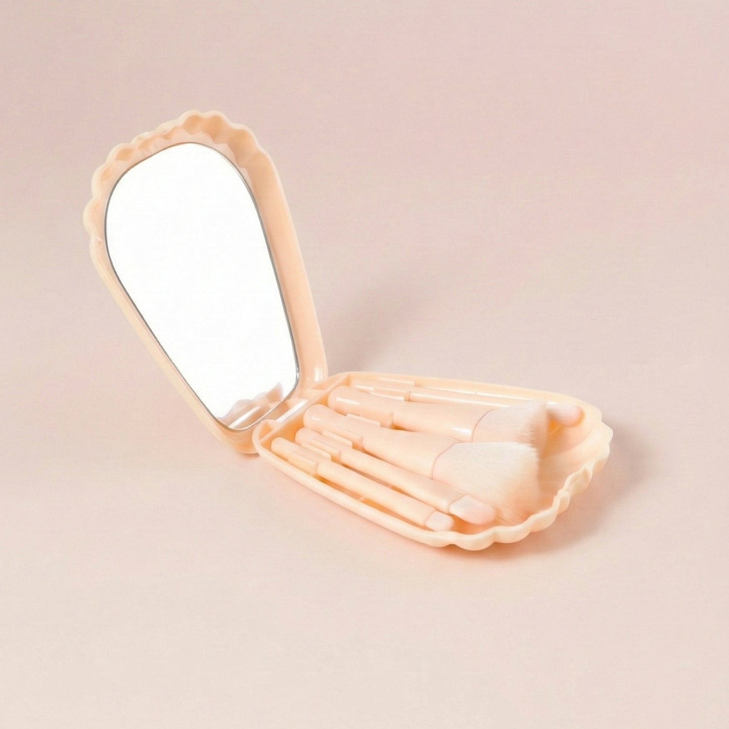 Travel friendly cosmetic kit with compact brush storage and mirror